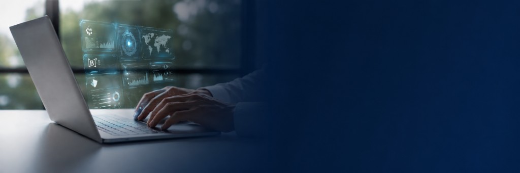 Profissional utilizando notebook com painéis digitais de dados financeiros